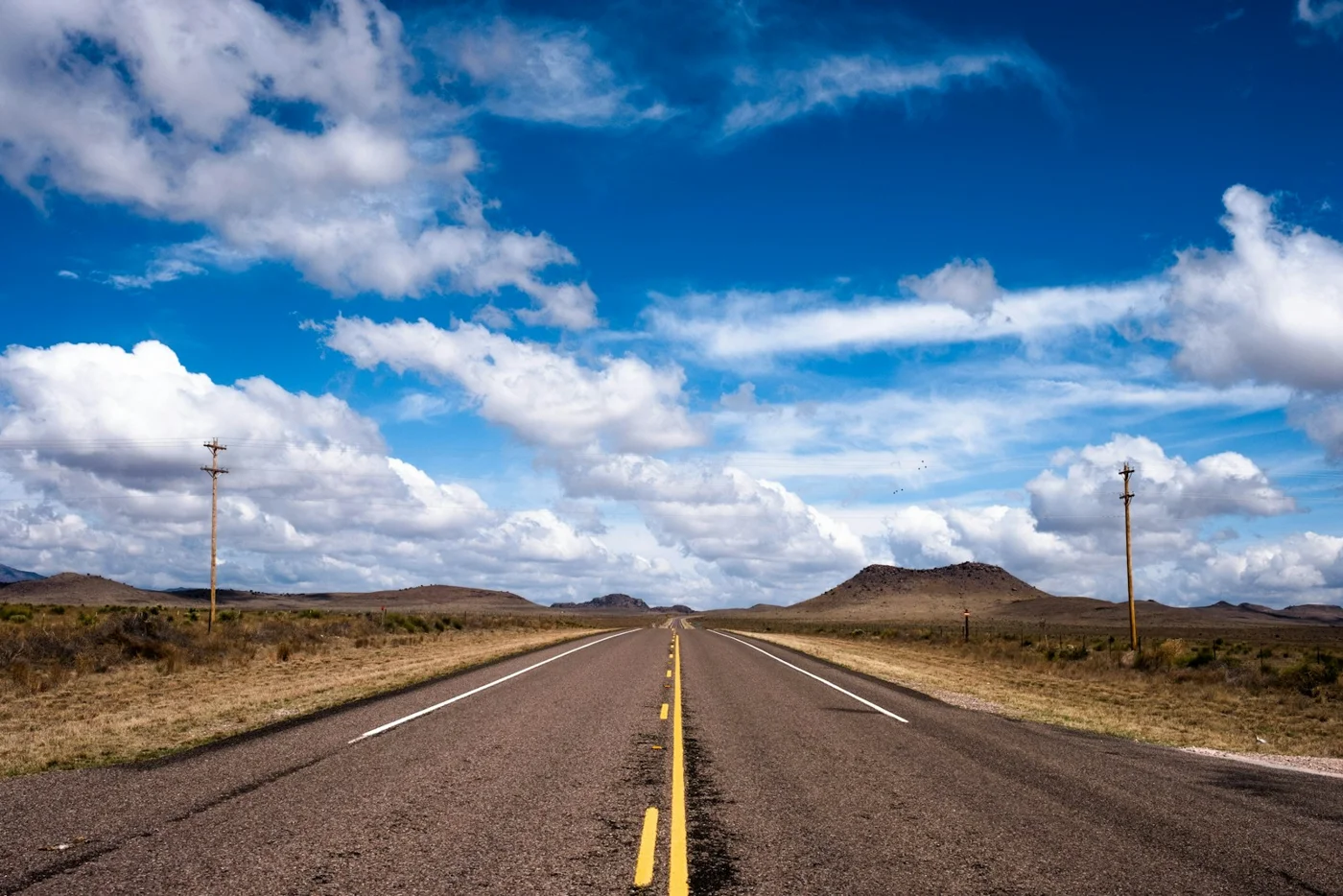 An open highway through the landscape of West Texas